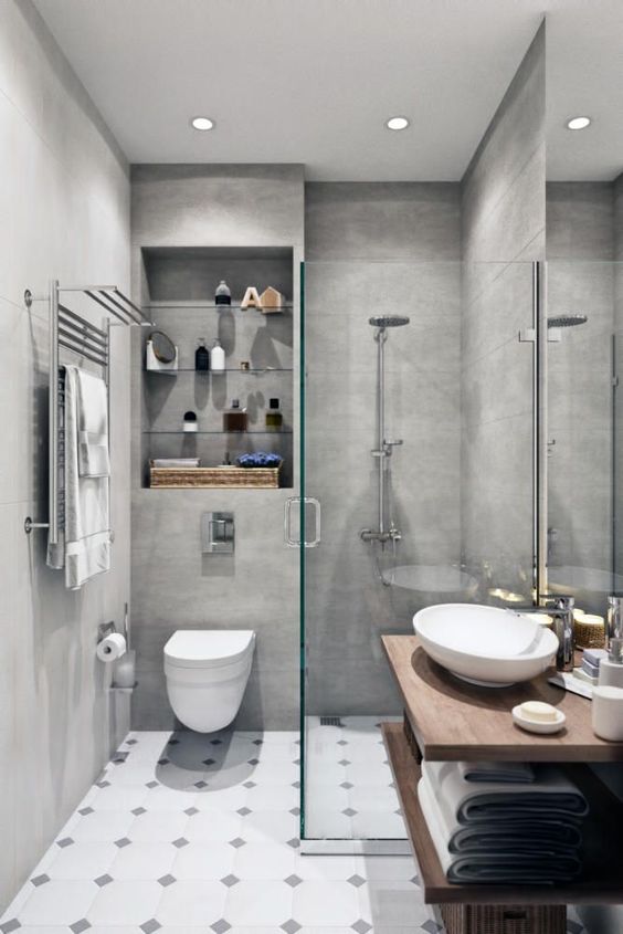 Glass doors divide a small bathroom easily for illusion of space